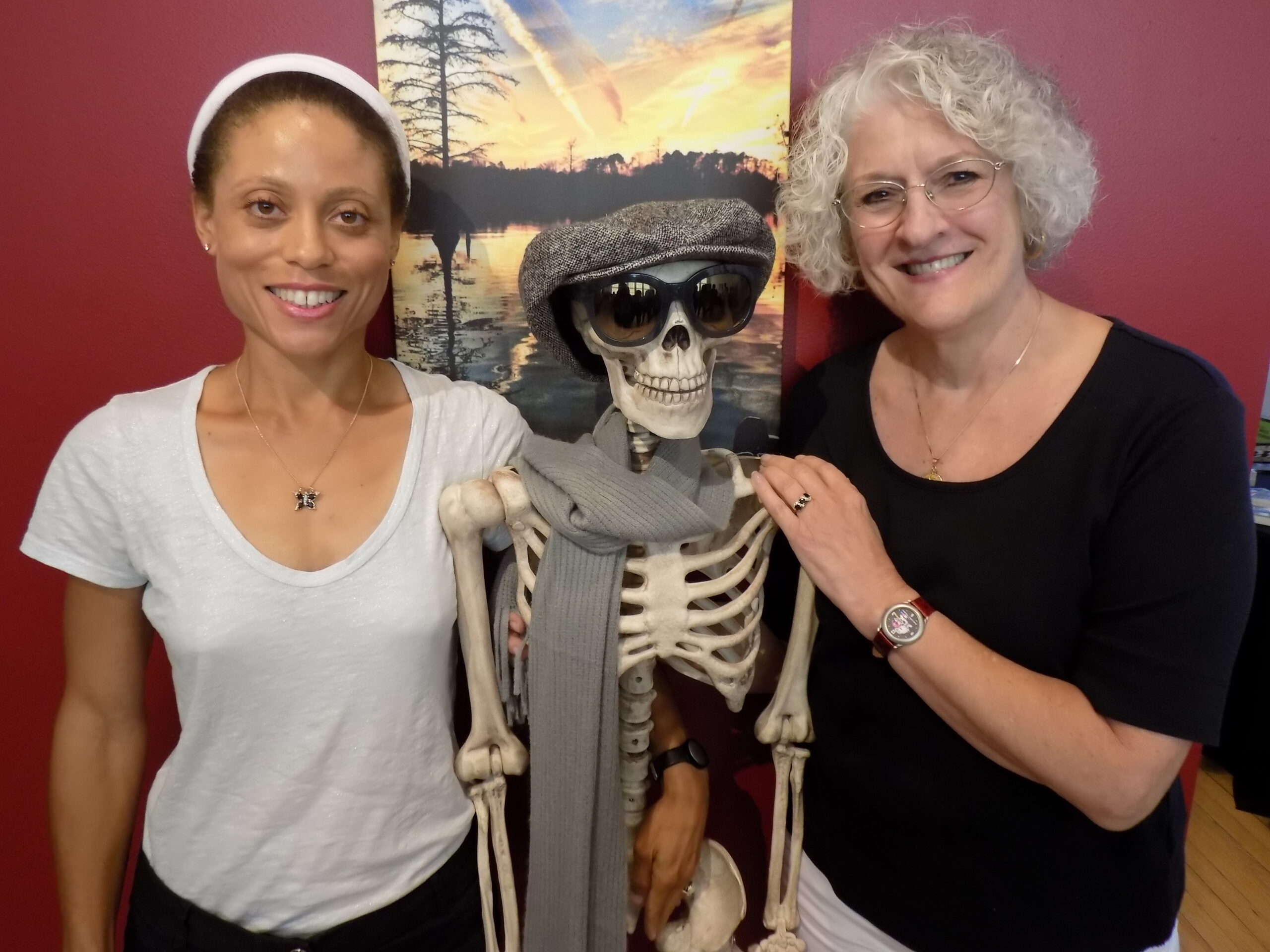 Cheryl and author Betsy Ashton, past president of the Virginia Writers Club, take a picture with an unfortunate guest at the Suffolk Mystery Authors Festival.